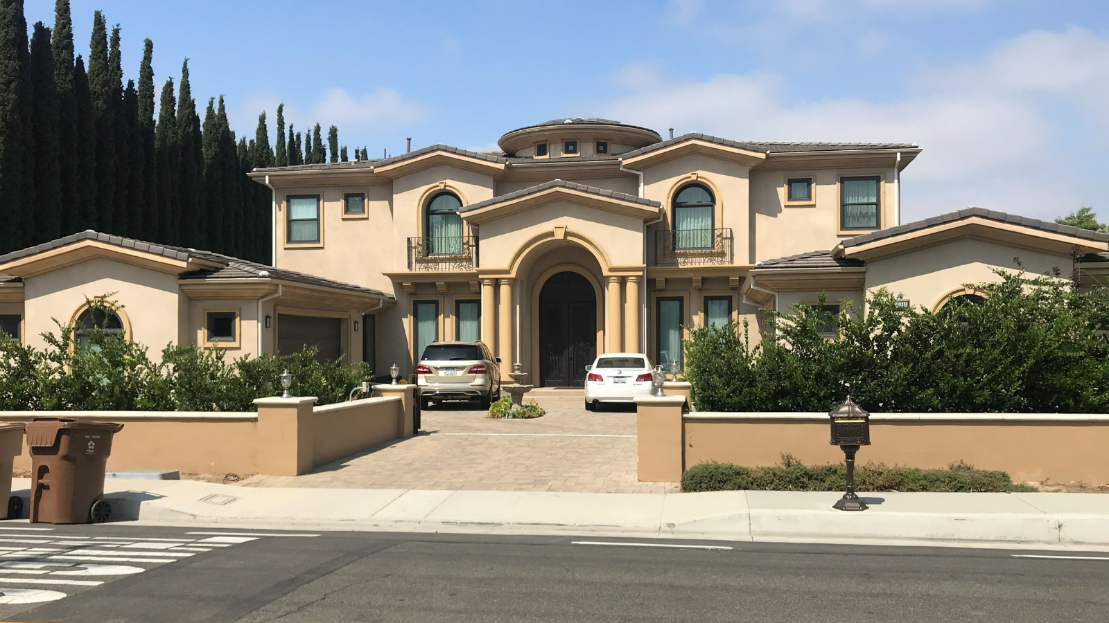 Custom hillside residence with stone and stucco exterior