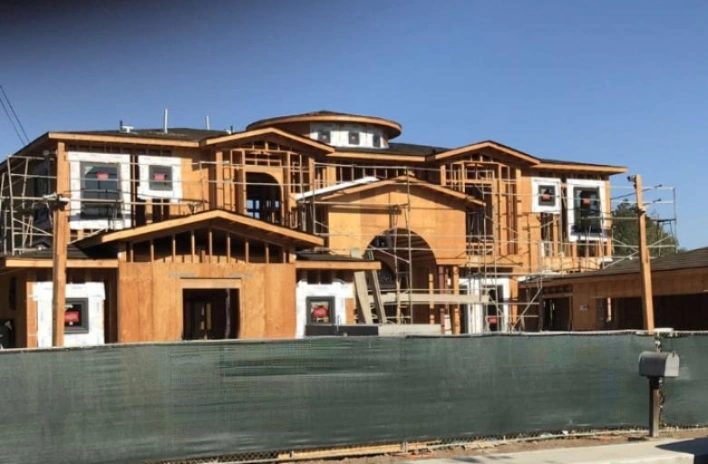 Complete wood framing exterior ready for plaster and stucco application by Newport Construction Group