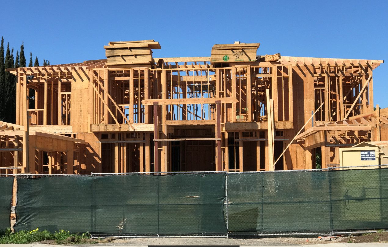 Structural wood framing phase for a custom residential build by Newport Construction Group in Villa Park