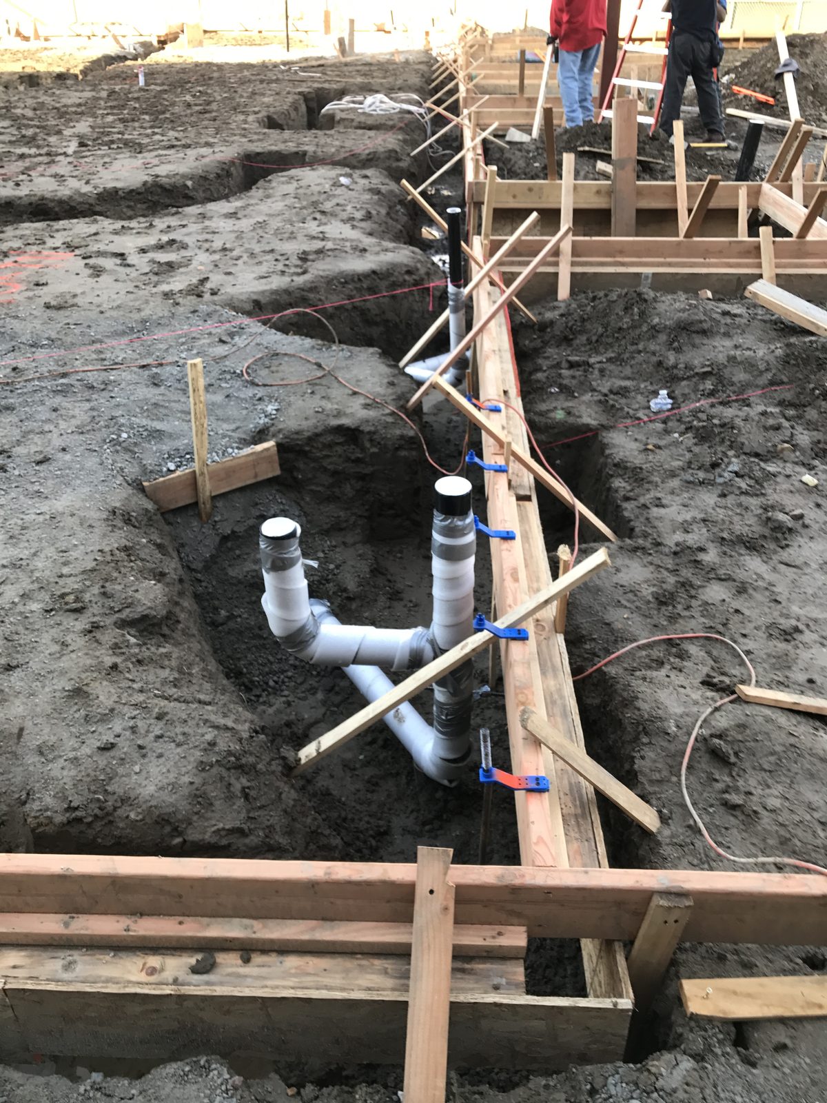 Underground DWV plumbing rough-in and trenching by Newport Construction Group civil engineers